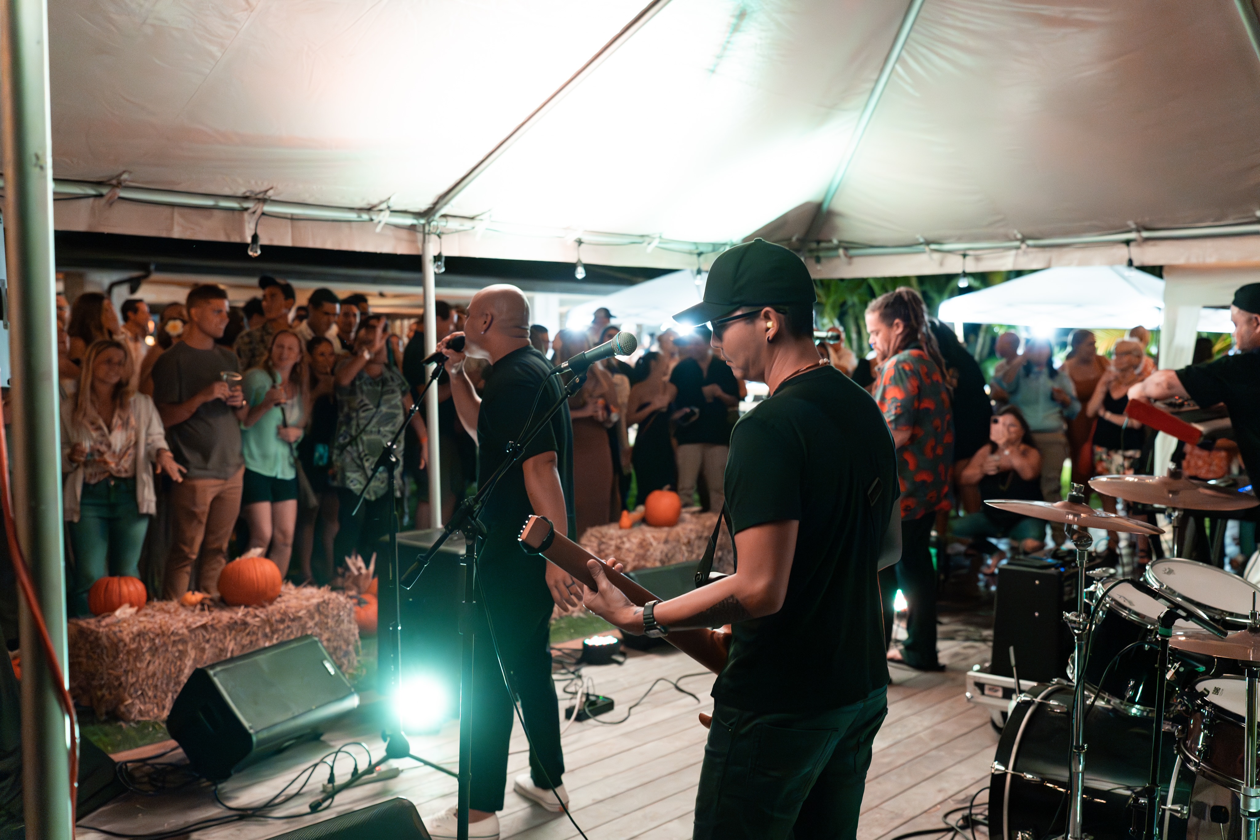 Shorebreak band on stage in front of a packed tent crowd